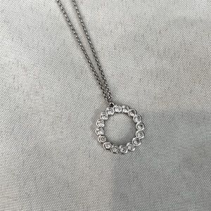 Kate Spade silver necklace with sparkly pendant.